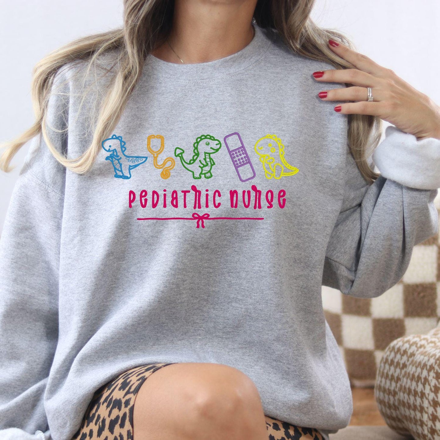 Pediatric Nurse Dinosaur Embroidery Sweatshirt – Cute Dino Medical Crewneck – Nurse Appreciation Gift – Colorful Stethoscope Design