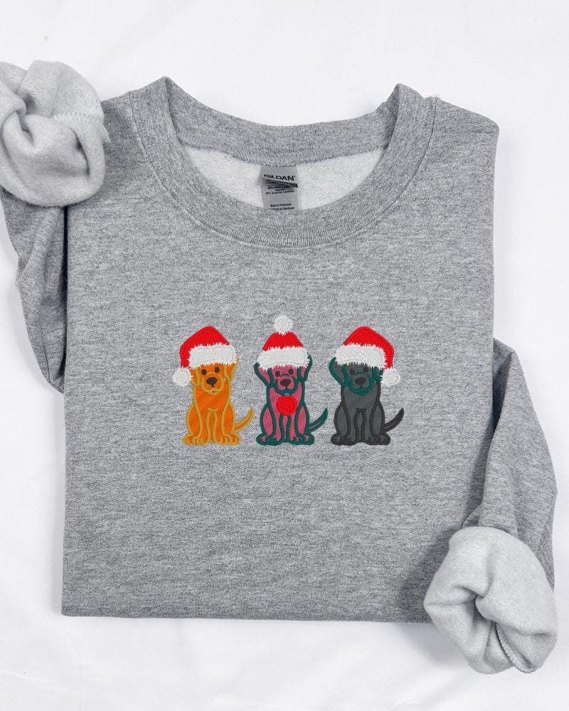 Christmas Dogs Sweatshirt – Embroidered Trio of Santa Hat Labs – Cozy Holiday Crewneck for Dog Lovers & Pet Parents