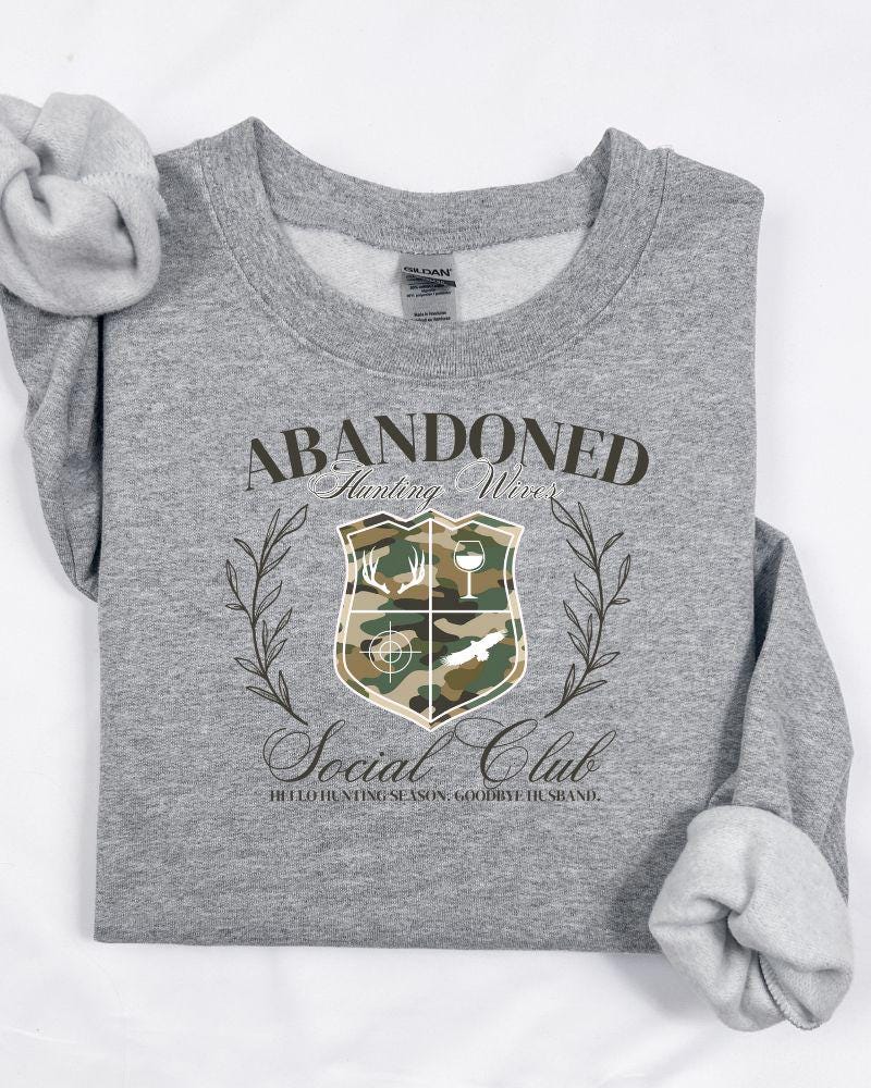 Abandoned Hunting Wives Sweatshirt – Funny Camo Fall Crewneck, Cozy Outdoor Wife Shirt, Hunting Season Gift for Her